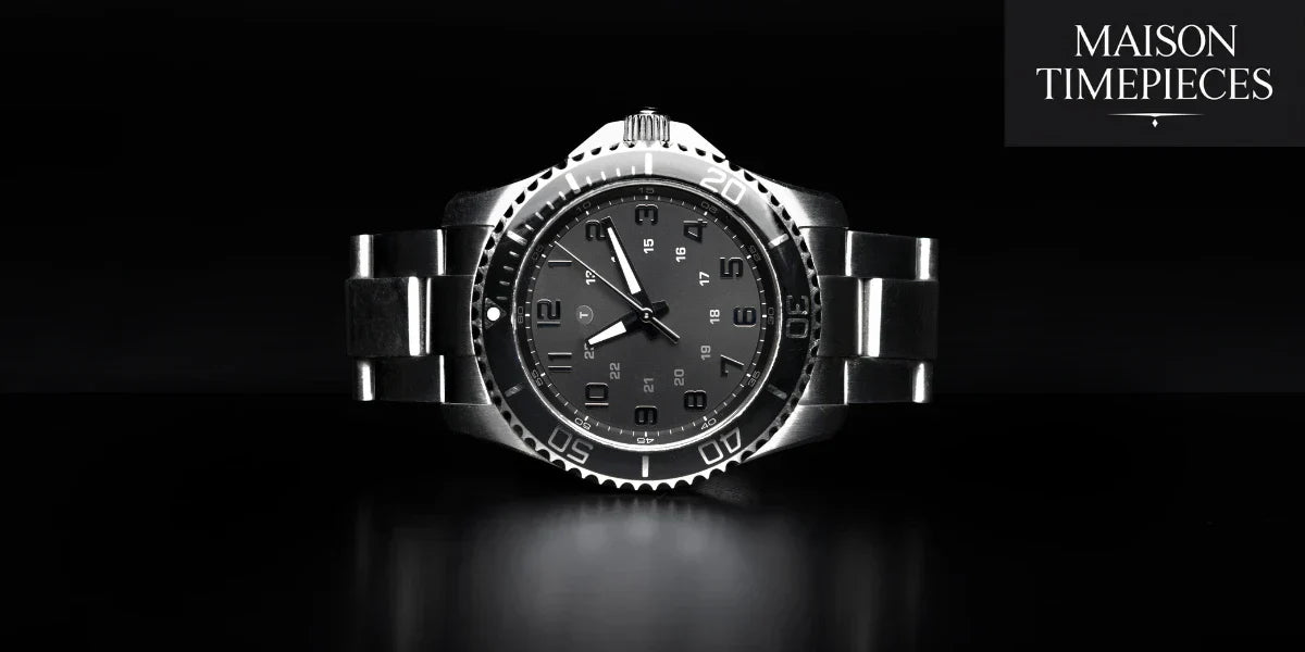 Close-up of a rugged stainless steel sports watch with black dial on a dark background, symbolizing masculine elegance and durability.