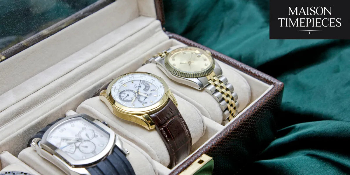 Close-up of three elegant men’s watches in a luxury leather display box — Maison Timepieces Singapore