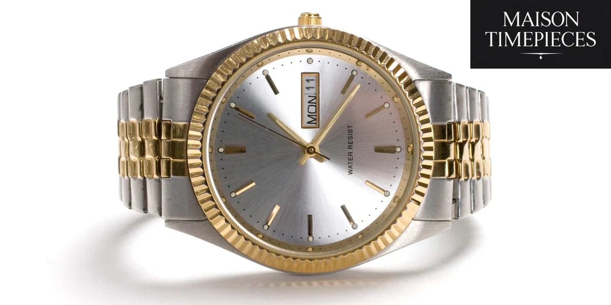 Two-tone men's dress watch with fluted bezel and day-date window from Maison Timepieces