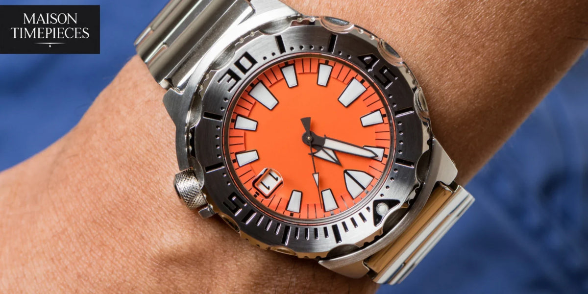 Citizen Promaster dive watch with orange dial worn on wrist, showcasing ISO-certified professional diver watch design