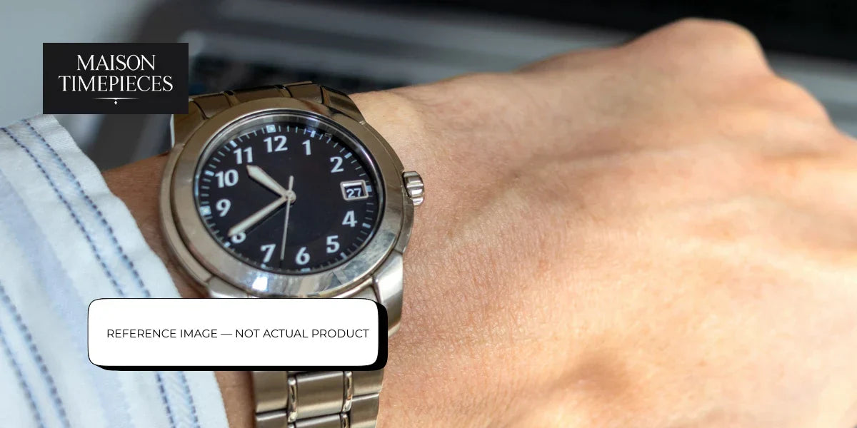Garrick style luxury British independent watch on wrist with stainless steel bracelet and black dial, Maison Timepieces Singapore reference image 