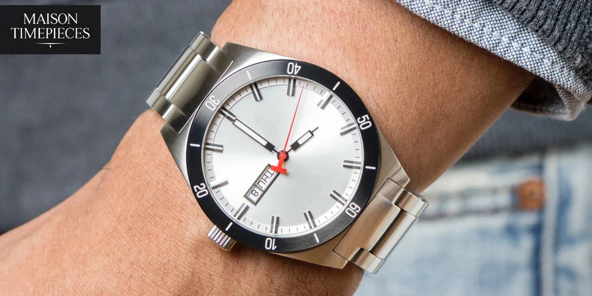 “Hugo Boss style stainless steel men’s watch with silver dial and red second hand worn on wrist – Maison Timepieces Singapore”