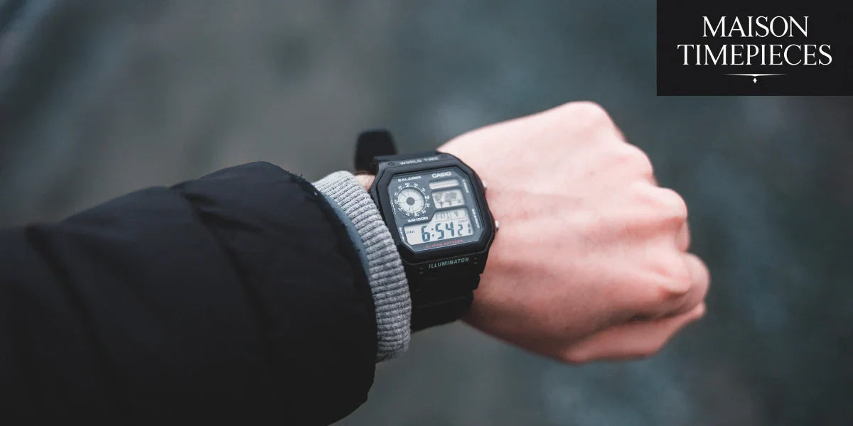 Black Casio G-Shock digital watch on wrist in cold-weather outfit by Maison Timepieces