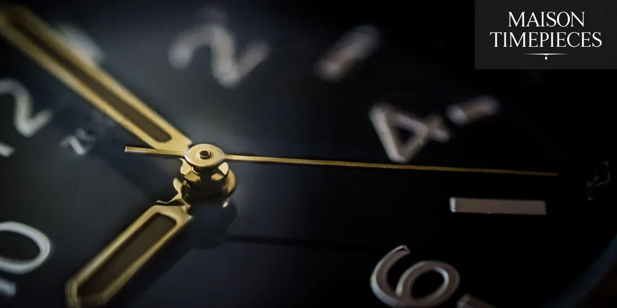 Close-up of luxury men's watch dial with gold hands and polished indices by Maison Timepieces
