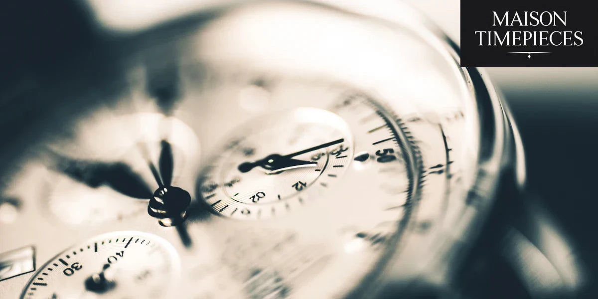 Close-up of a vintage chronograph watch dial with Maison Timepieces logo