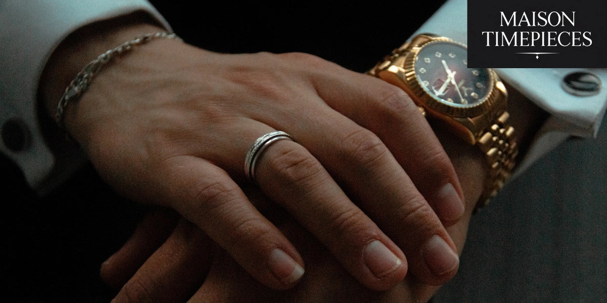 gold luxury timepiece on wrist with formal attire, Maison Timepieces branding