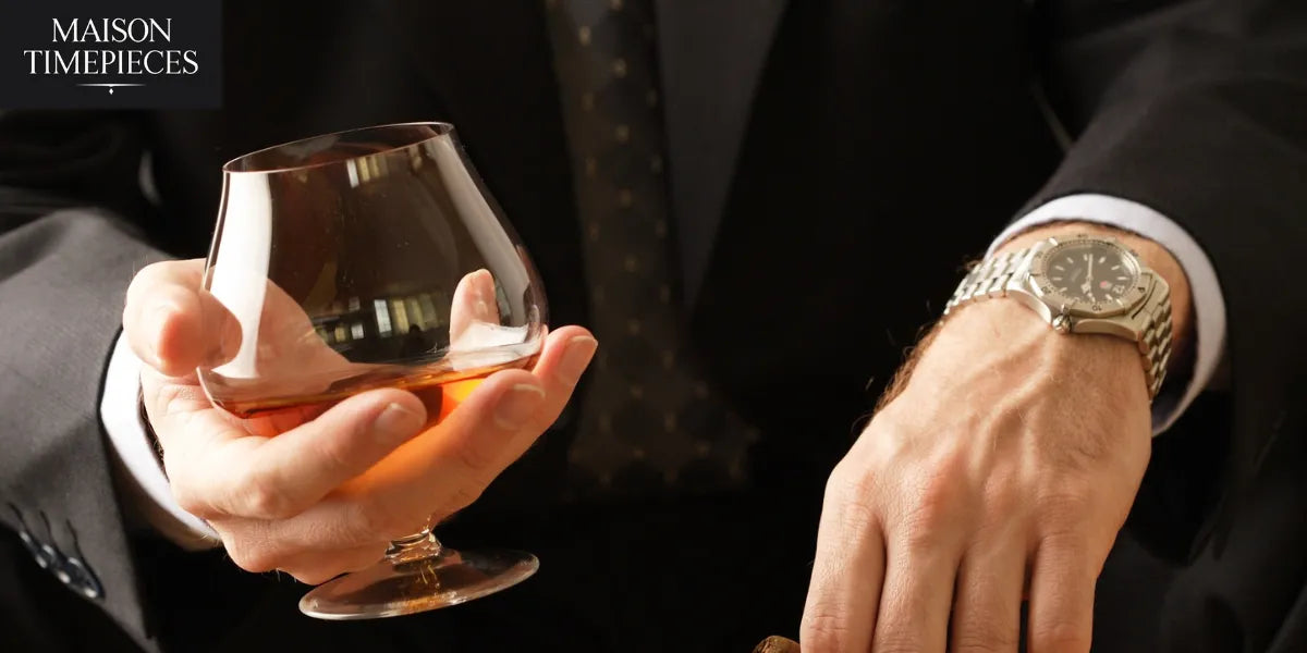 “Elegant men’s wristwatch with stainless steel bracelet worn with a suit, luxury lifestyle photo by Maison Timepieces.”