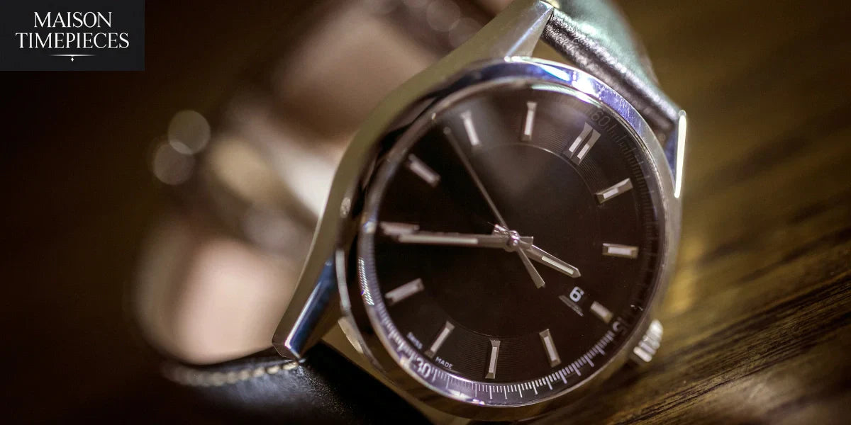 Luxury black dial wristwatch representing Rolex dealers in Singapore by Maison Timepieces