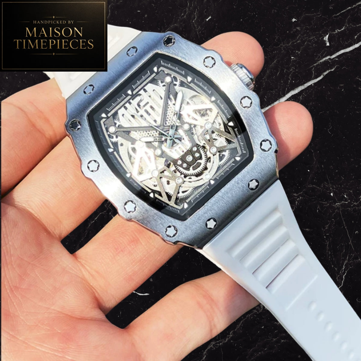 Maison Timepieces Curated automatic skeleton tonneau watch with rose gold alloy case, blue skeleton dial, automatic mechanical movement, exhibition caseback and blue silicone strap.