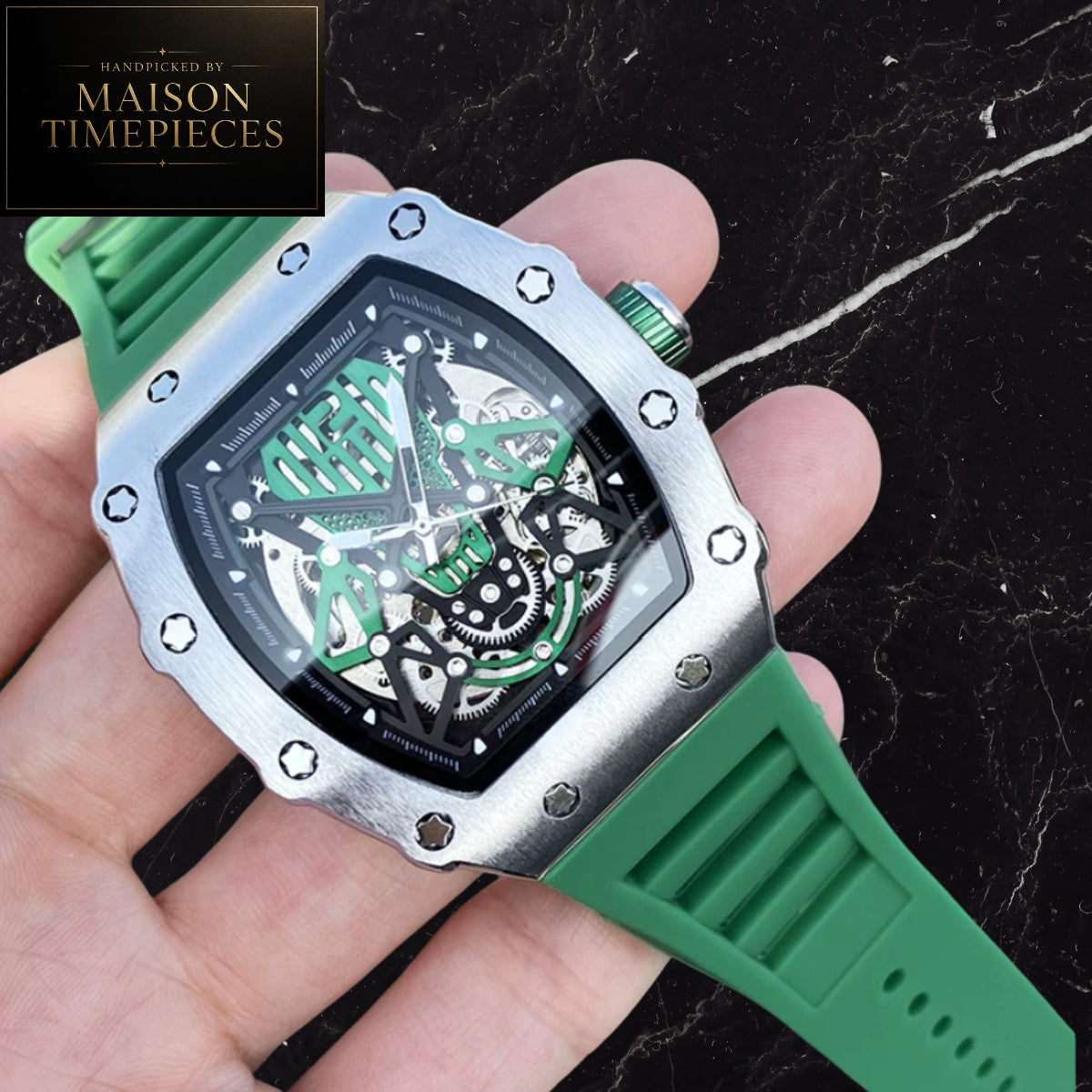 Maison Timepieces Curated automatic skeleton tonneau watch with rose gold alloy case, blue skeleton dial, automatic mechanical movement, exhibition caseback and blue silicone strap.
