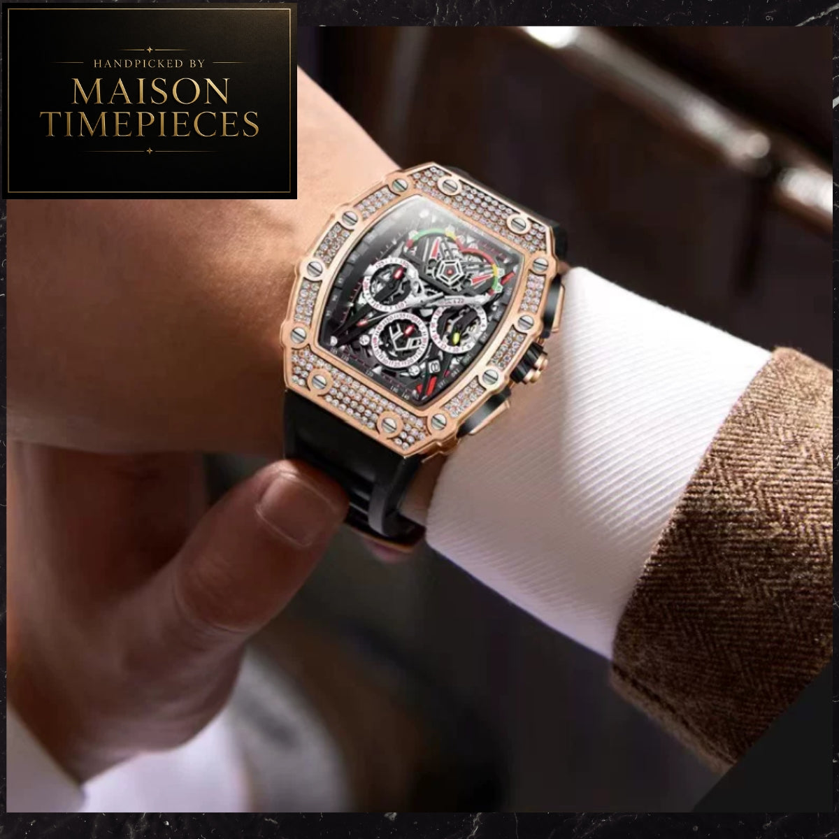 A luxury watch with a rose gold octagonal case, crystal-encrusted bezel, and black dial, shown being worn on a wrist with a white dress shirt cuff. A black logo card in the top left reads 'Handcrafted by Maison Timepieces'.