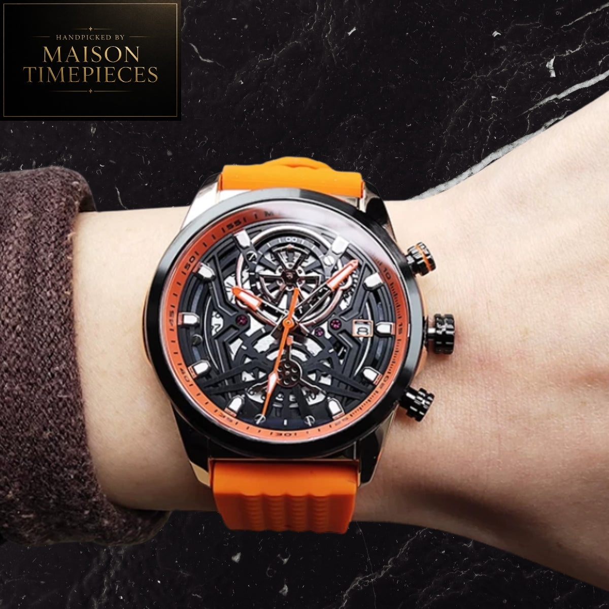 Maison Timepieces Curated skeleton quartz sports watch with black open-work dial, orange silicone strap, luminous hands, date display and 44mm alloy case.