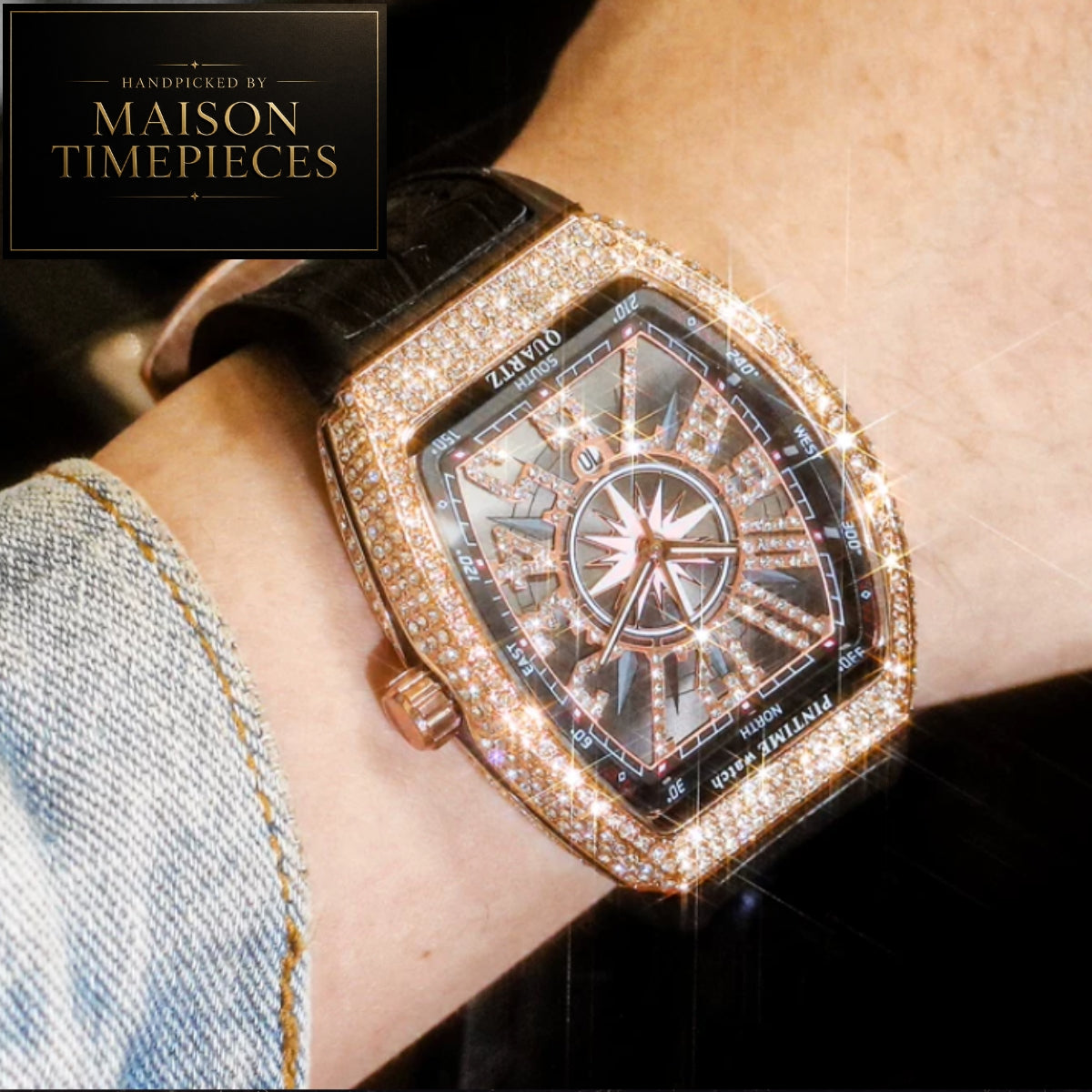 A close-up lifestyle shot of a Maison Timepieces watch on a person's wrist. The watch features a rectangular, rounded square case encrusted with sparkling diamonds, a black dial with a central compass rose design, and a black leather strap.