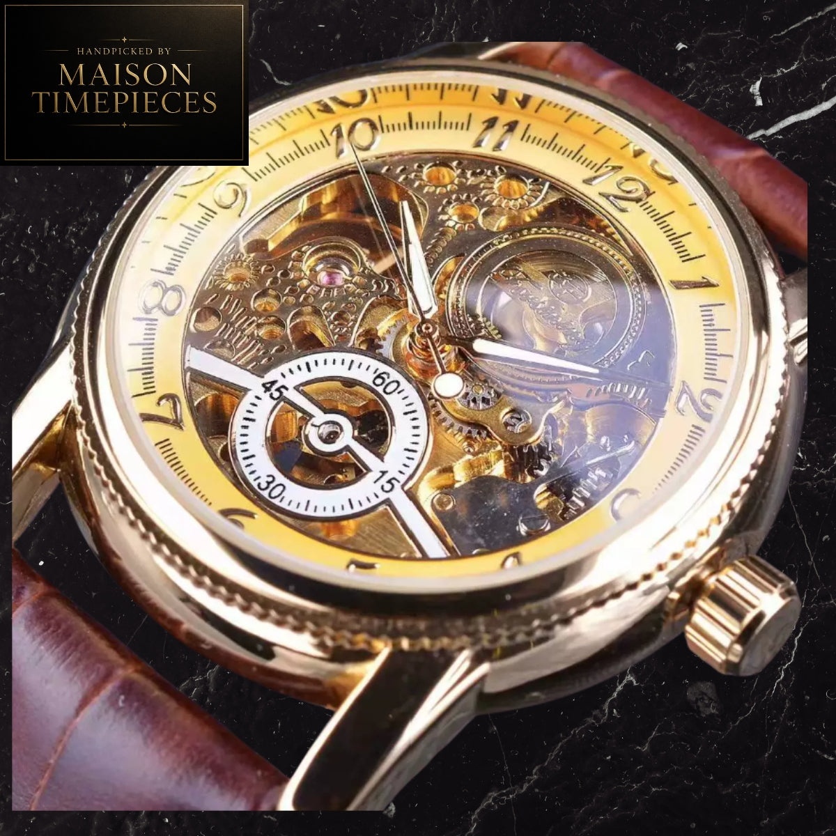 A close-up of a skeleton wristwatch with a gold-tone case, transparent dial showing intricate internal gears, a yellow-toned inner ring, white numerals, and a brown leather strap on a dark marbled surface. A black square logo in the top-left reads 'Handpicked by Maison Timepieces'.