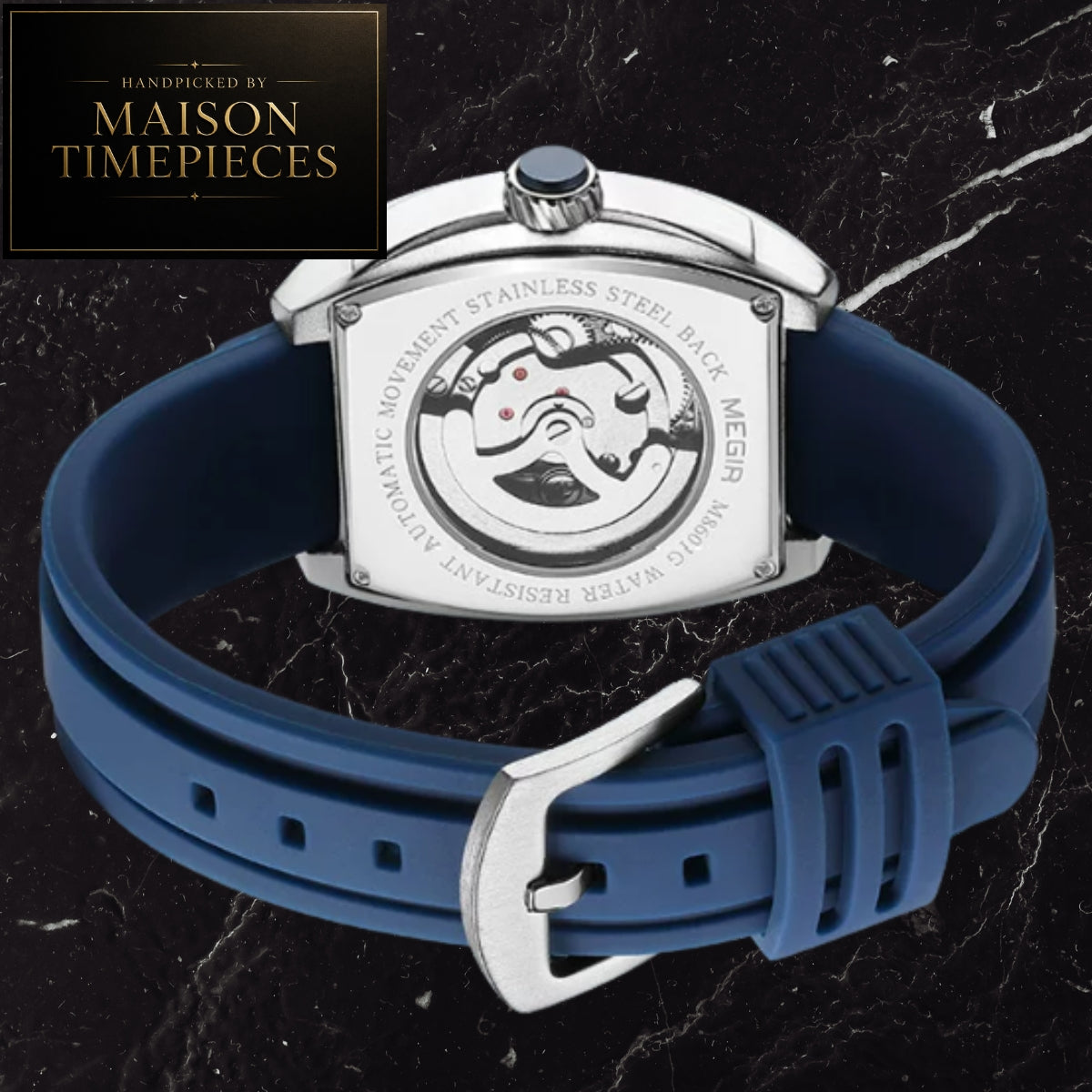 A Maison Timepieces men's watch shown from the back, featuring a silver stainless steel case with a visible mechanical movement and a blue silicone strap, set against a black marble background with a brand logo overlay in the top-left corner.