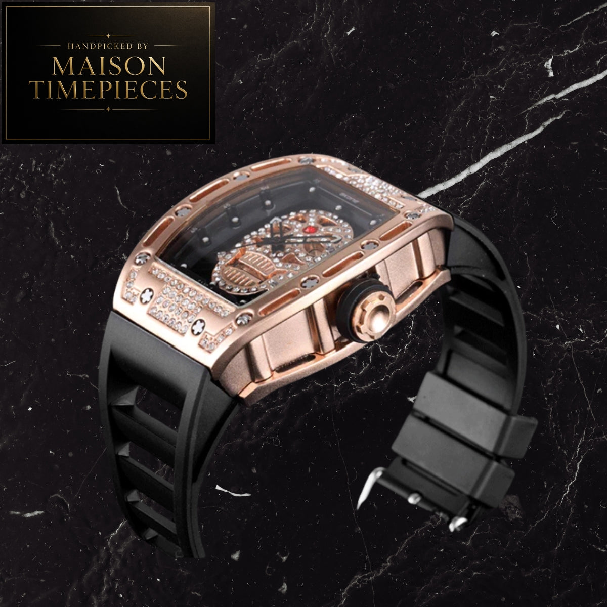 A luxury watch by Maison Timepieces, featuring a rose gold case encrusted with diamonds, a skeletonized black dial, and a black rubber strap, displayed on a black marble background.