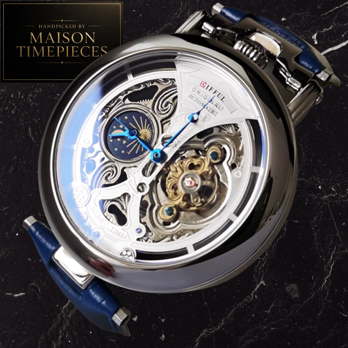 A close-up of a Maison Timepieces Gifuel automatic watch with a polished silver-tone case, skeleton dial showing intricate internal gears, blue hands and subdial, and a blue strap, photographed on a dark marble surface with a Maison Timepieces logo in the top-left corner.