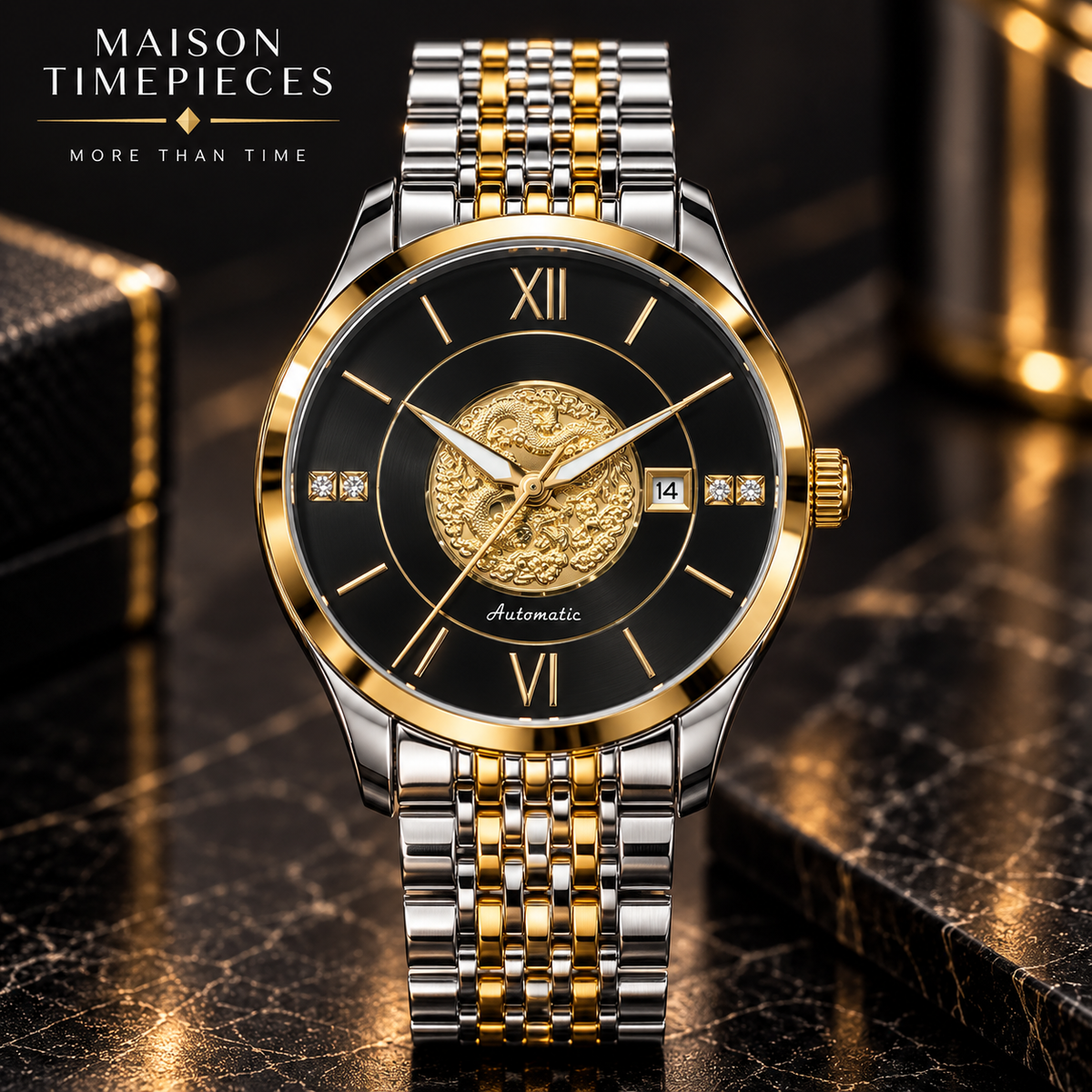 A Maison Timepieces automatic watch with a two-tone silver and gold metal bracelet, a gold case, and a black dial featuring a central gold relief design. The watch is displayed on a dark, reflective marble surface with a blurred luxury background.
