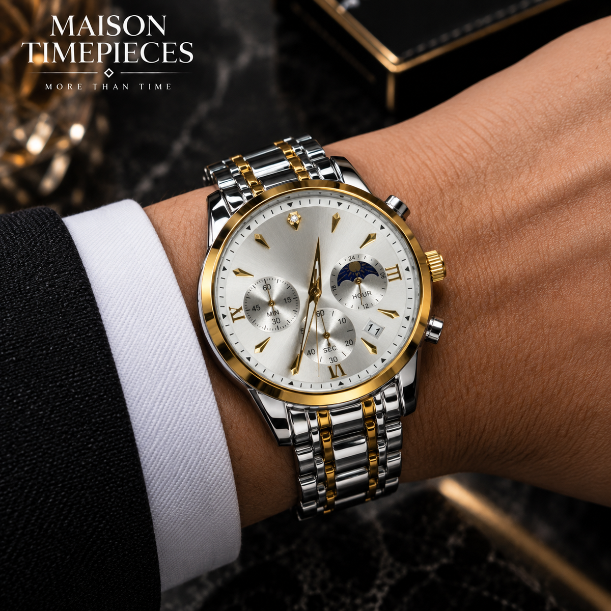 Close-up of Maison Timepieces Curated watch showing polished silver and gold-tone metal bracelet detailing