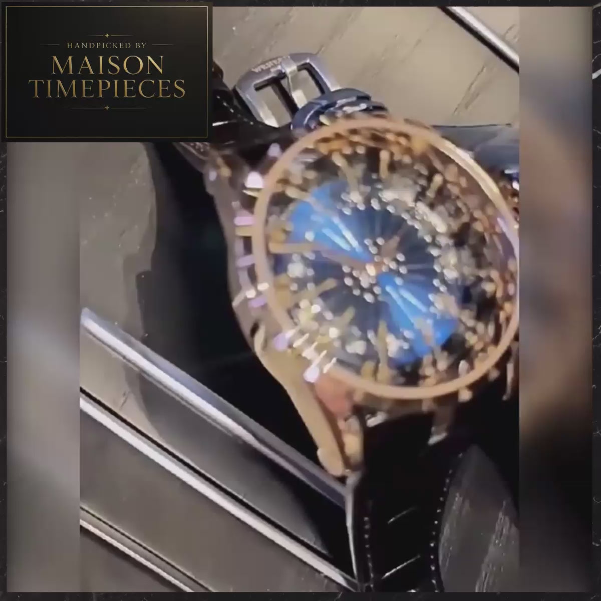 Maison Timepieces Curated artistic knights dial quartz watch with sculpted knight figures, blue decorative dial, rose gold-tone stainless steel case and black genuine leather strap.