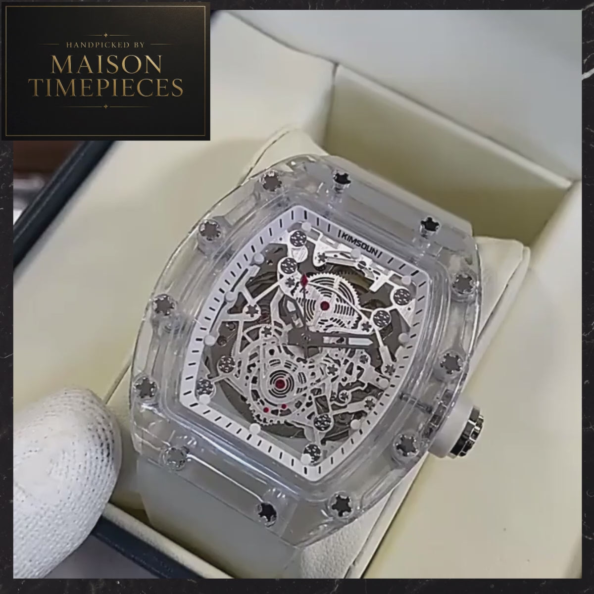 Maison Timepieces Curated automatic skeleton transparent tonneau watch with clear case, white silicone strap, 44mm case and exposed mechanical movement.