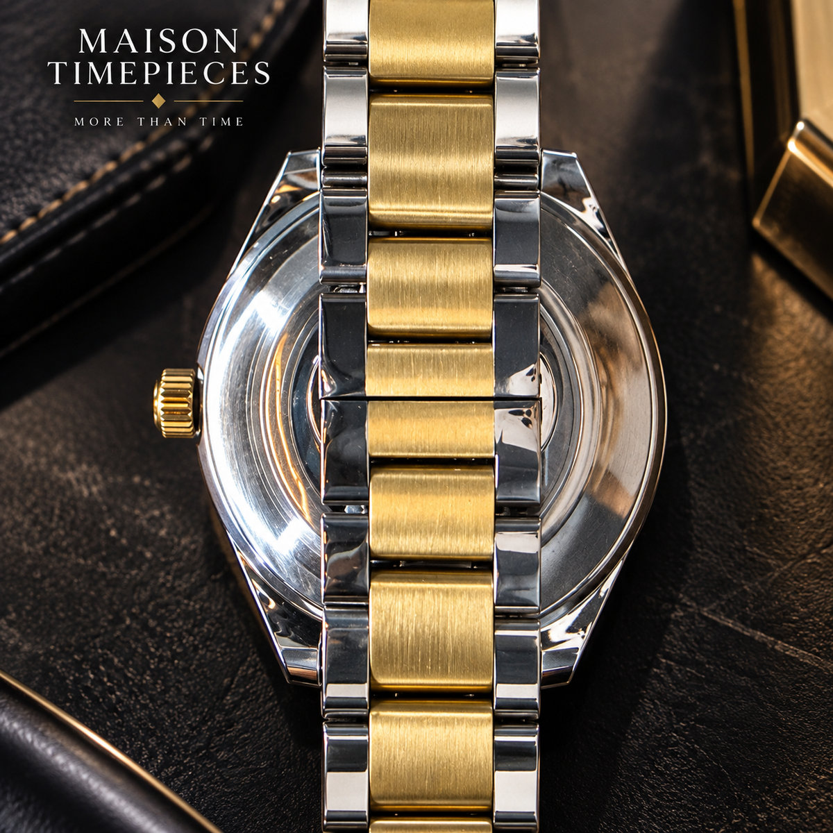 Two-tone gold and silver automatic watch worn on wrist with white dial and gold bezel