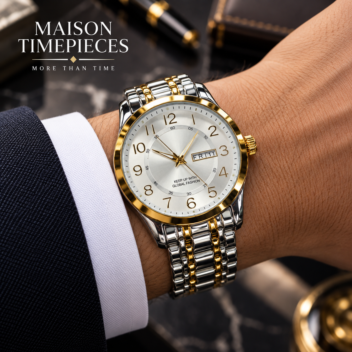 Two-tone gold and silver watch with white dial worn with a business suit